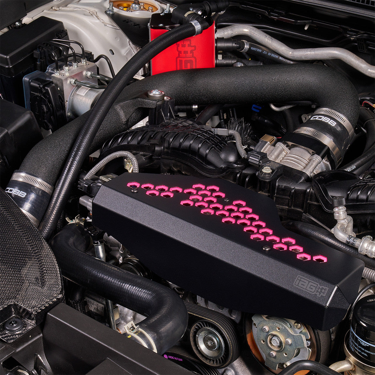 IAG Alternator Cover For 2022-26 WRX - Pink Installed Close-up