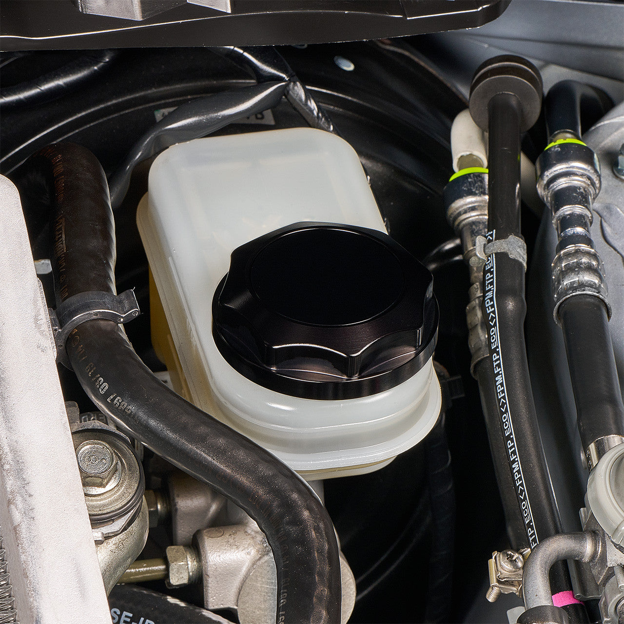 IAG Revolve Engine Bay Dress-Up Cap Kit for 15-21 STI - Black Brake Cap Install Close-up 2