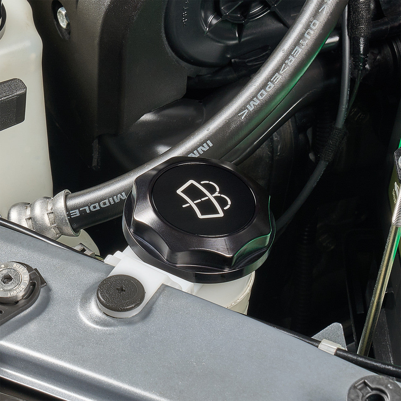 IAG Revolve Engine Bay Dress-Up Cap Kit for 15-21 STI - Black Washer Cap Install Close-up